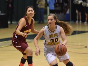 Homer senior Aurora Waclawski dribbles around Mt. Edgecumbe defender Julie Amaktoolik in Friday's Class 3A girls state semifinal at the Alaska Airlines