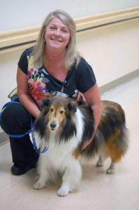 Kelley Kress and her dog, Kody, pose at Central Peninsula Hospital on Thursday, Aug. 23, 2018, in Soldotna, Alaska. Kress and Kody volunteer as part of the hospital auxiliarys pet therapy program. (Photo by Erin Thompson/Peninsula Clarion)