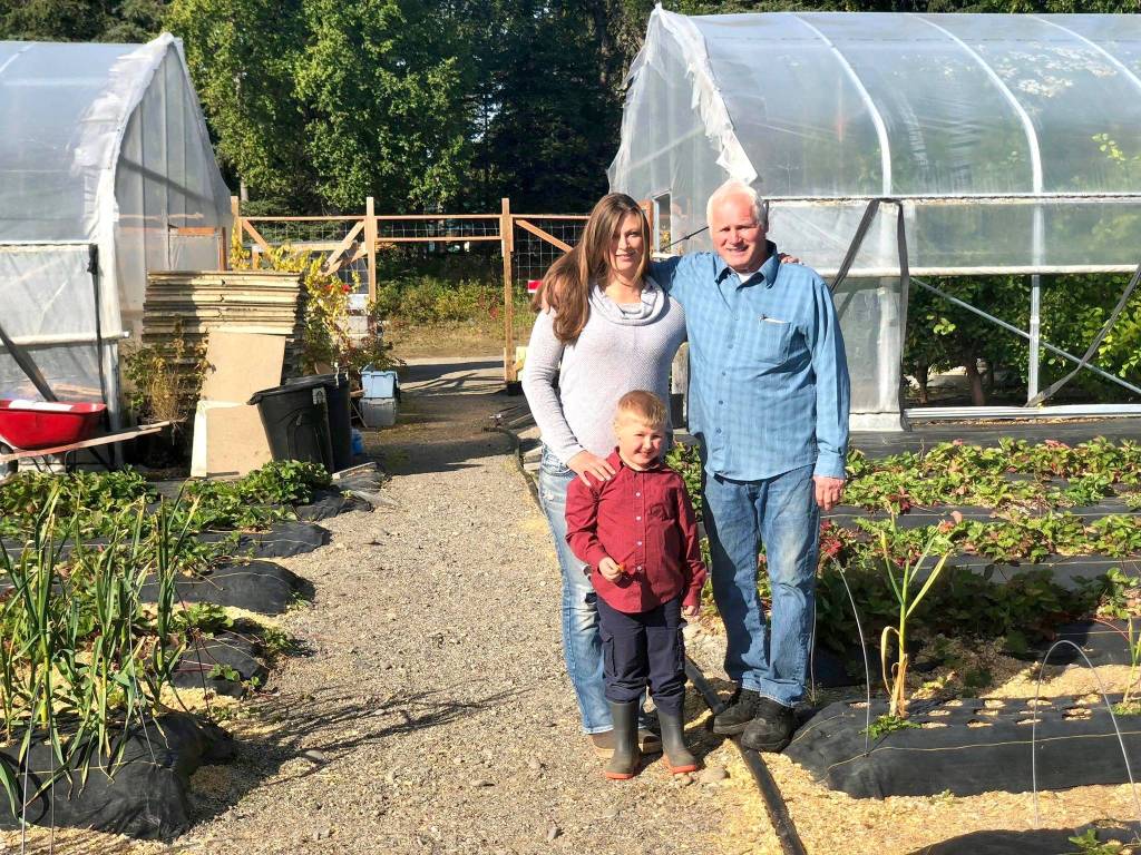OBrien Gardens and Trees is a family affair operated by owner Michael OBrien, with help from his daughter Michelle LaVigueur and her children, including Wyatt LaVigueur on Tuesday, Sept. 4, in Nikiski, Alaska. (Photo by Victoria Petersen/Peninsula Clarion)