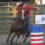 A rider and her horse round a barrel Saturday, Sept. 8 at the 9/11 Tribute Rodeo at the Soldotna Rodeo Grounds in Soldotna, Alaska. (Photo by Joey Klecka/Peninsula Clarion)