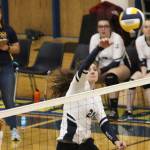 Homers Marina Carroll spikes the ball over the net during a game against Kenai Central High School on Thursday, Sept. 13, 2018 at Homer High School in Homer, Alaska. The Mariners beat the Kardinals three games to one in the Southcentral Conference match-up. (Photo by Megan Pacer/Homer News)