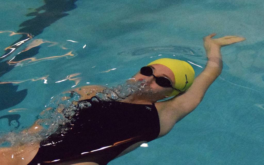 Homer swimmer Adeline Berry prepares to surface after the start of the girls 50-yard backstroke Friday at the SoHi Pentathlon in the Soldotna High School pool. (Photo by Joey Klecka/Peninsula Clarion)