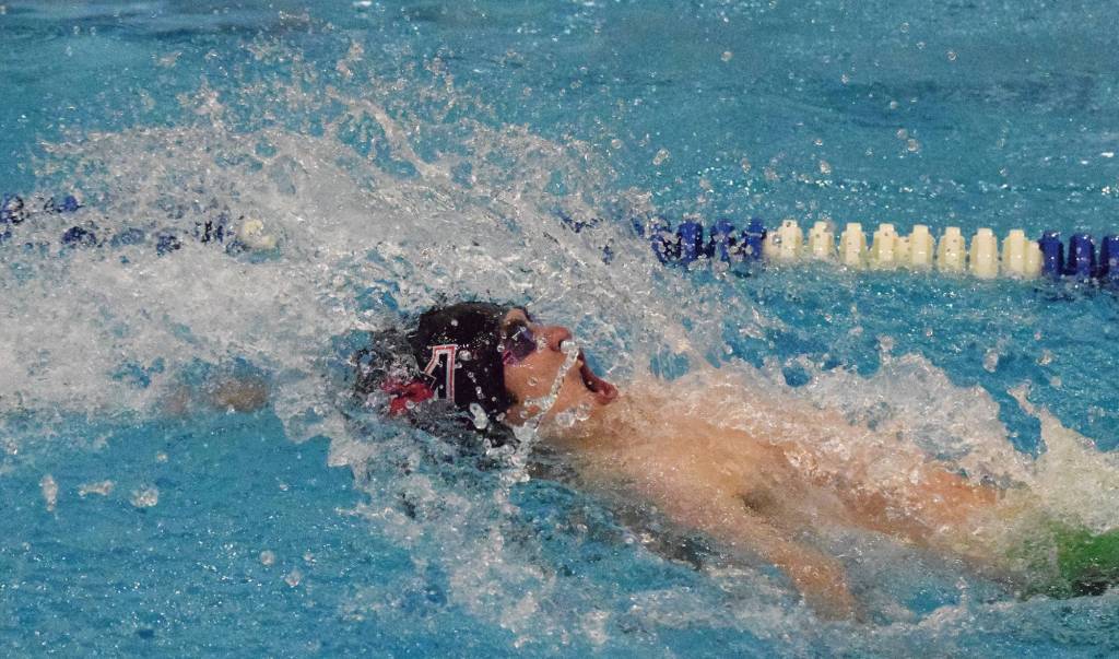 Kenais Savaii Heaven works the boys 50-yard backstroke Friday at the SoHi Pentathlon in the Soldotna High School pool. (Photo by Joey Klecka/Peninsula Clarion)