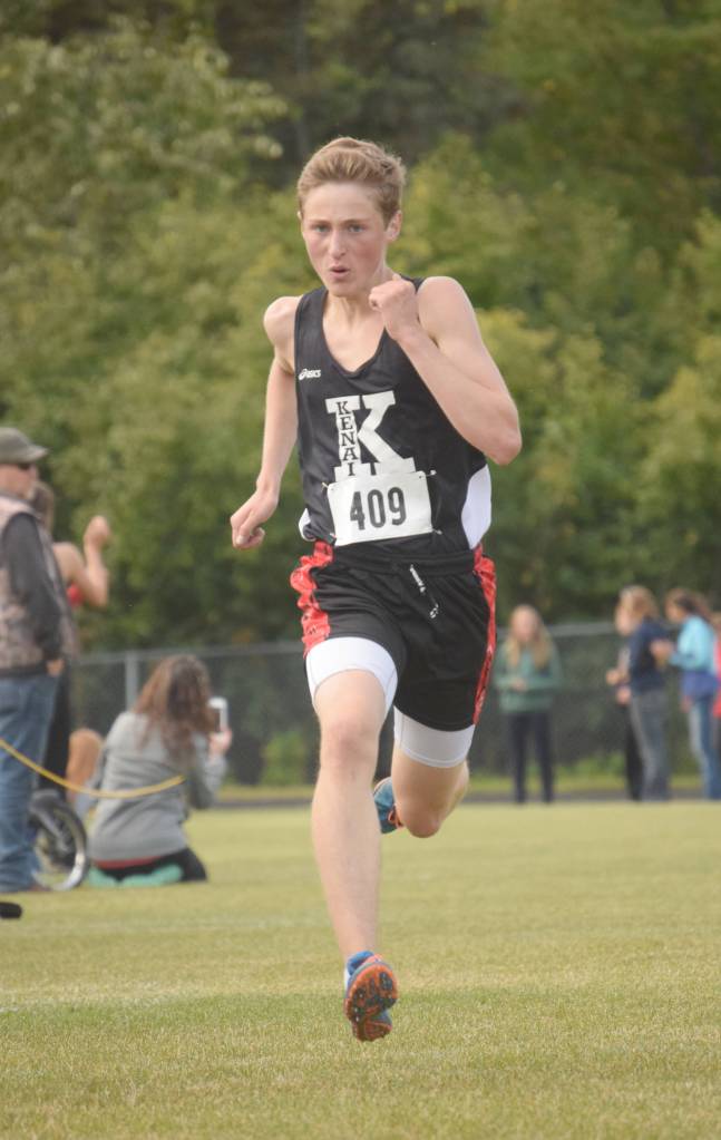 Kenai Centras Maison Dunham sprints out a win Saturday, Sept. 15, 2018, at the Kenai Peninsula Borough meet in Nikiski. (Photo by Jeff Helminiak/Peninsula Clarion)