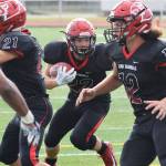 Kenai running back Titus Riddall eyes an opening Saturday against Eagle River at Ed Hollier Field in Kenai. (Photo by Joey Klecka/Peninsula Clarion)