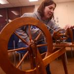 Suzanne Hall prepares to spin wool into yarn during the first session of the Soldotna Community Schools yarn-spinning class on Tuesday, March 20 in the library of the Soldotna Preparatory School in Soldotna, Alaska. (Ben Boettger/Peninsula Clarion)