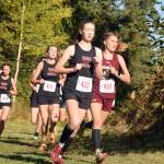 Kenai Centrals Jaycie Calvert leads Grace Christians Mazzy Jackson, and Kenai Centrals Brooke Satathite and Summer Foster, early in the Division II girls race at the Region 3 meet Saturday, Sept. 22, 2018, at Tsalteshi Trails. (Photo by Jeff Helminiak/Peninsula Clarion)