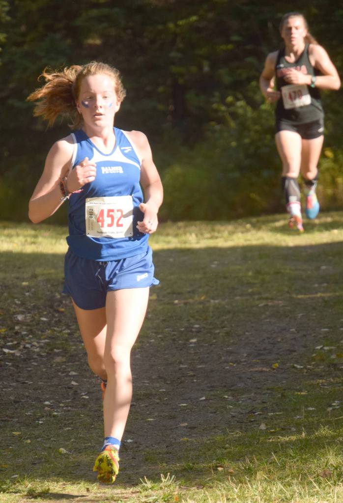 Palmers Katey Houser leads Wasillas Allison VanPelt with about a kilometer left in the Division I girls race at the Region 3 meet at Tsalteshi Trails on Saturday, Sept. 22, 2018. Houser won, while VanPelt was second. (Photo by Jeff Helminiak/Peninsula Clarion)