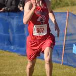 Anchorage Christian Schools sophomore Tristian Merchant finishes off his victory in the Division II boys race at the Region 3 meet Saturday, Sept. 22, 2018, at Tsalteshi Trails. (Photo by Jeff Helminiak/Peninsula Clarion)