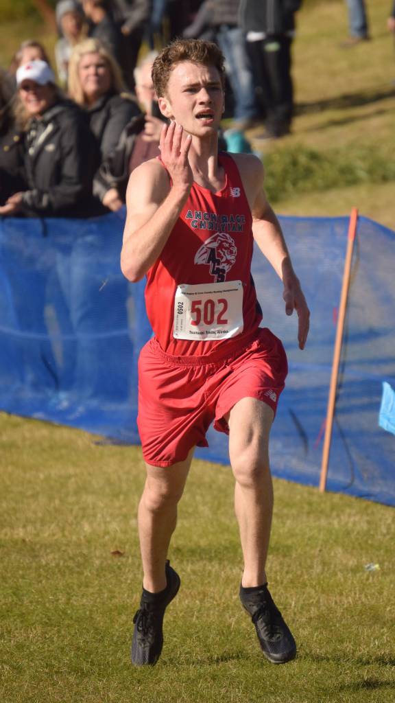 Anchorage Christian Schools sophomore Tristian Merchant finishes off his victory in the Division II boys race at the Region 3 meet Saturday, Sept. 22, 2018, at Tsalteshi Trails. (Photo by Jeff Helminiak/Peninsula Clarion)