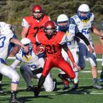 Kenais Zach Burnett (21) finds an opening in the defense Saturday afternoon against Kodiak at Kenais Ed Hollier Field. (Photo by Joey Klecka/Peninsula Clarion)