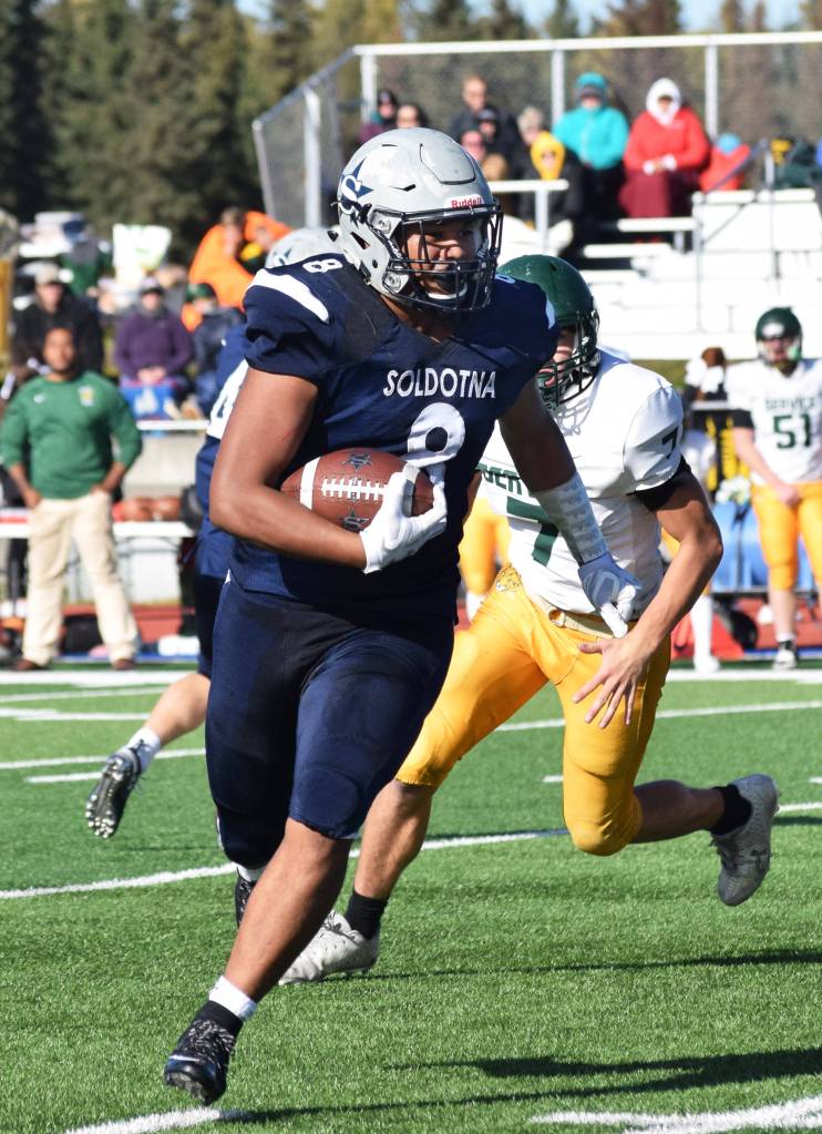 Soldotna running back Aaron Faletoi finds room to run against the Service Cougars defense Saturday afternoon at Justin Maile Field. (Photo by Joey Klecka/Peninsula Clarion)