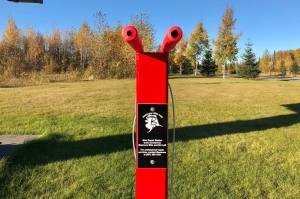A new fix-it bike station set up on Monday by the Soldotna Parks and Recreation Department and bike advocacy group, BIK&S, AK, is photographed on Tuesday in Soldotna. The fix it station features a bike stand, tools and a tire pump. (Photo by Victoria Petersen/Peninsula Clarion)