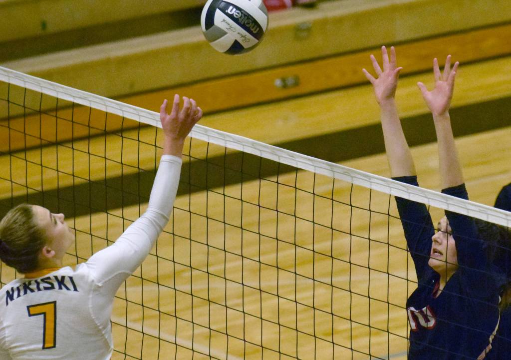 Nikiskis Bethany Carstens and Kenai Centrals Abby Every joust for the ball Tuesday, Sept. 25, 2018, at Nikiski High School. (Photo by Jeff Helminiak/Peninsula Clarion)