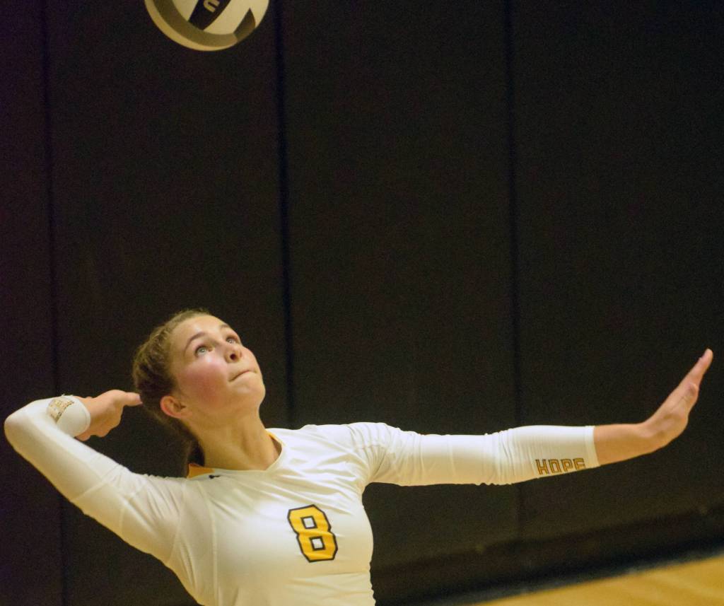 Nikiskis Kaitlyn Johnson serves to Kenai Central on Tuesday, Sept. 25, 2018, at Nikiski High School. (Photo by Jeff Helminiak/Peninsula Clarion)
