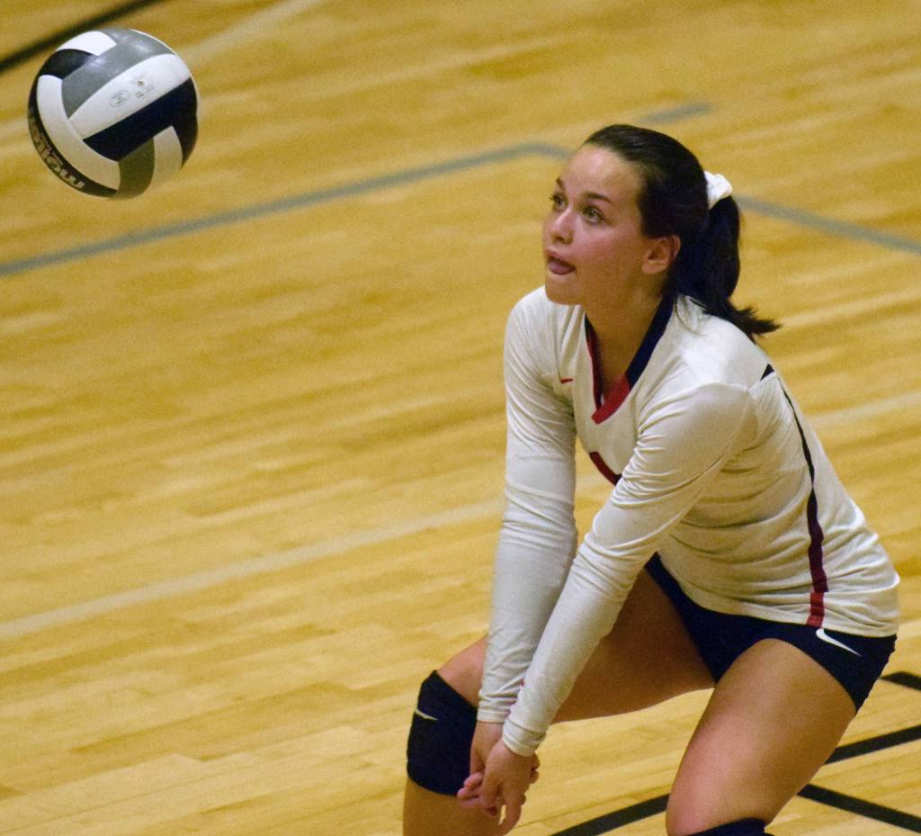 Kenai Centrals Jenna Streiff digs the ball against Nikiski on Tuesday, Sept. 25, 2018, at Nikiski High School. (Photo by Jeff Helminiak/Peninsula Clarion)