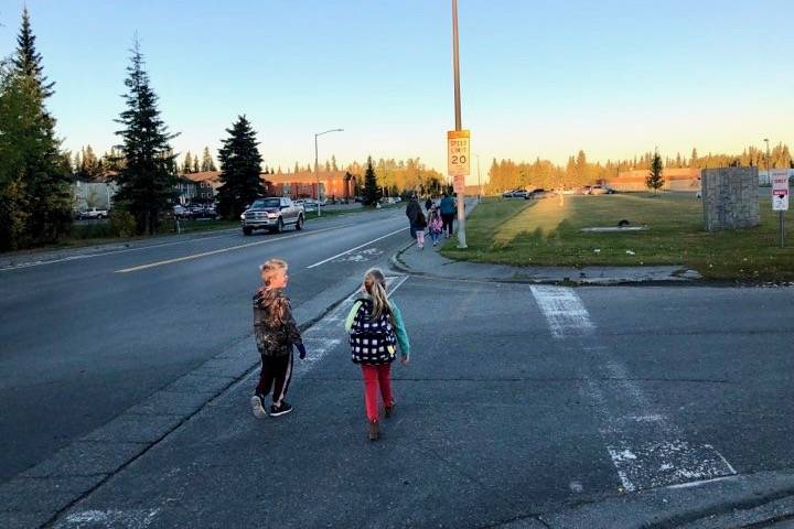 Students safely cross the street on their way to school for Walk to School Day, on Tuesday, Sept. 25, 2018, in Soldotna, Alaska. (Photo by Victoria Petersen/Peninsula Clarion)