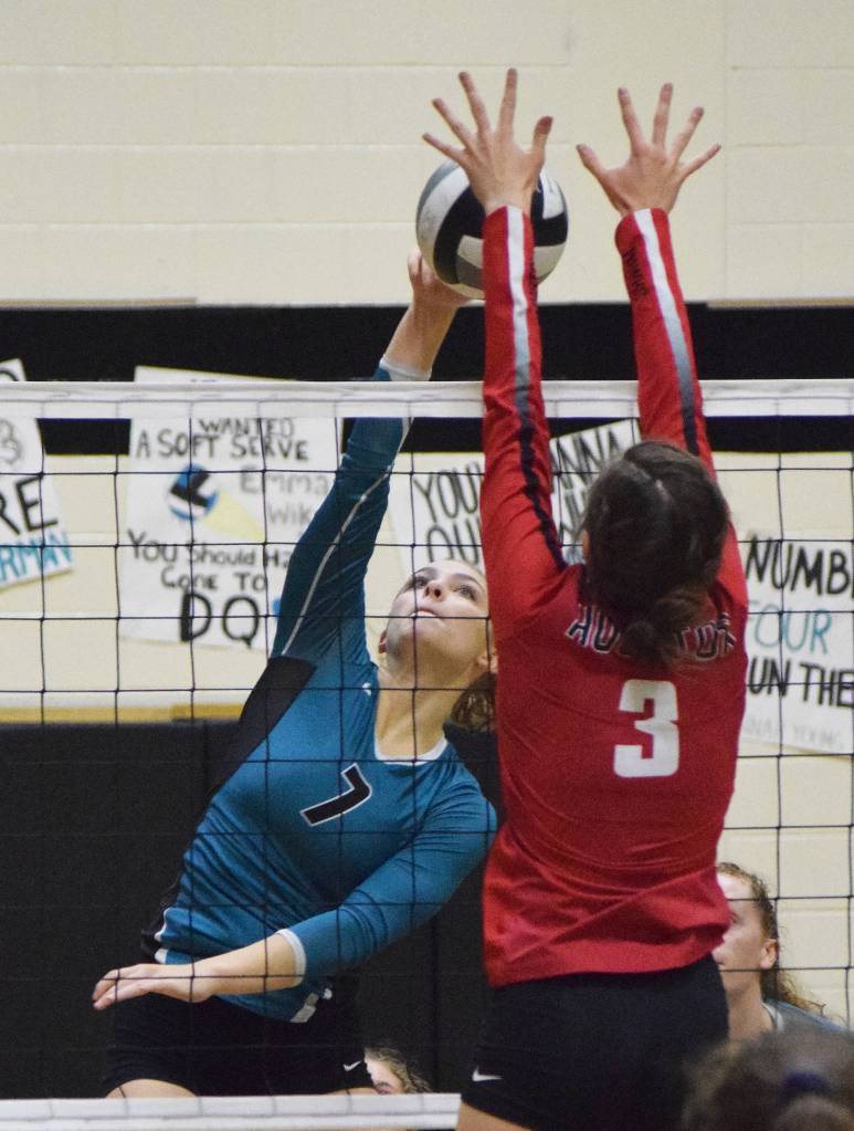 Nikiski senior Bethany Carstens attempts to get a ball by Houstons Jaydin Winzenburg (3) Friday night at Nikiski High School. (Photo by Joey Klecka/Peninsula Clarion)