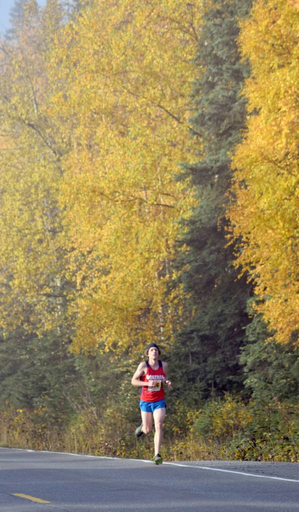 Soldotnas Dan McIntosh flies down Beaver Loop Road on the way to victory in the half marathon of the Kenai River Marathon on Sunday, Sept. 30, 2018. (Photo by Jeff Helminiak/Peninsula Clarion)
