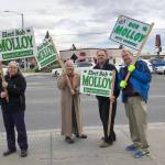 Supporters campaign for Kenai City Council member Bob Molloy on the corner of Main Street Loop and Kenai Spur Highway on Tuesday, Oct. 2, 2018 in Kenai, Alaska. (Photo by Victoria Petersen/Peninsula Clarion)