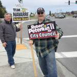 A supporter of Robert Peterkin, who ran for Kenai City Council, campaigns along the Kenai Spur Highway on Tuesday, Oct. 2 in Kenai, Alaska. (Photo by Victoria Petersen/Peninsula Clarion)