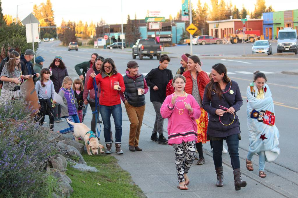 Participants in a Light the Night march head out on their walk from WKFL Park on Saturday, Sept. 29, 2018 in Homer, Alaska to honor those lost to addiction and those living in recovery. (photo by Megan Pacer/Homer News)