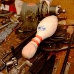 A broken pin sits on a workbench in the backroom of the Kenai bowling on Saturday, Nov. 14 in Kenai. The bowling alley is now owned by the city of Kenai, which will soon begin seeking management for it. (Ben Boettger/Peninsula Clarion)