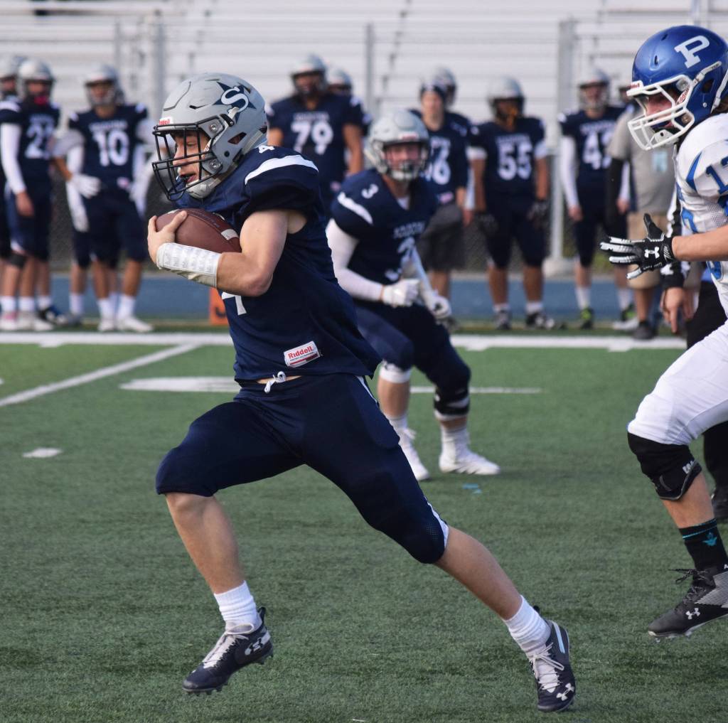 Soldotna junior Jersey Truesdell clears the Palmer defense for a long run in a Division II state semifinal game Saturday afternoon at Palmers Machetanz Field. (Photo by Joey Klecka/Peninsula Clarion)