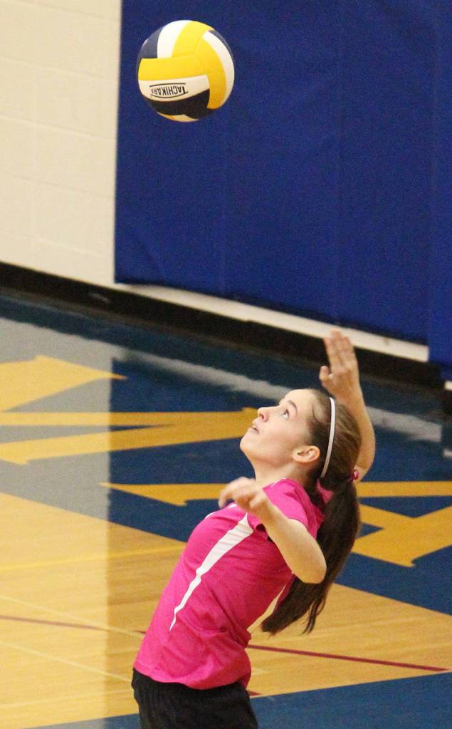 Homers Laura Inama jumps to serve the ball to the Soldotna High School volleyball team during their game Tuesday, Oct. 9, 2018 at Homer High School in Homer, Alaska. (Photo by Megan Pacer/Homer News)