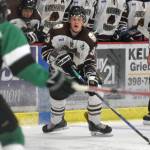 Kenai River Brown Bears defenseman JJ Boucher looks for an opening Friday, Oct. 5, 2018, against the Chippewa (Wisconsin) Steel at the Soldotna Regional Sports Complex. (Photo by Jeff Helminiak/Peninsula Clarion)