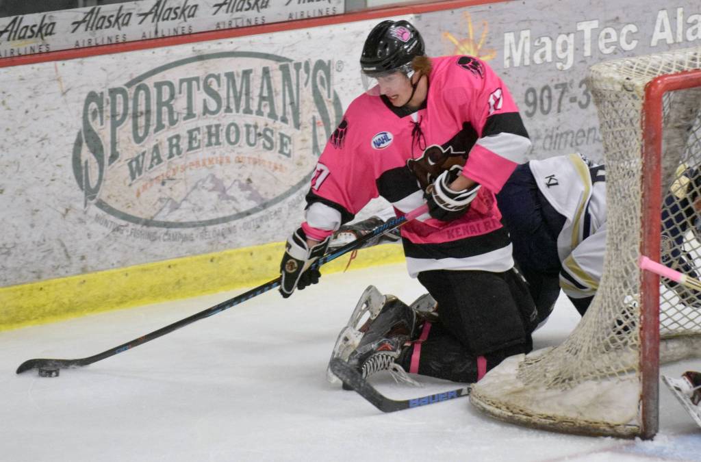 Kenai River Brown Bears forward Sutton McDonald tries to push the puck in front of the net against the Janesville (Wisconsin) Jets on Friday at the Soldotna Regional Sports Complex. (Photo by Jeff Helminiak/Peninsula Clarion)