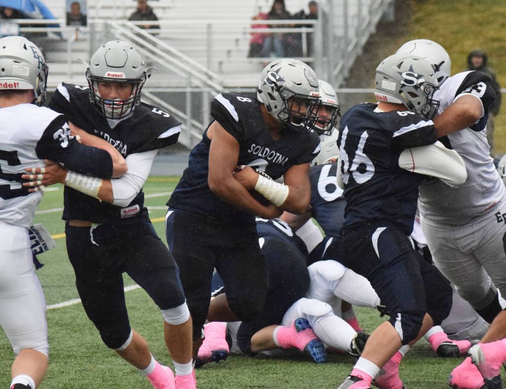 Soldotna junior Aaron Faletoi (8) finds room to run against Eagle River Saturday in the Division II state football championship game at Machetanz Field in Palmer. (Photo by Joey Klecka/Peninsula Clarion)