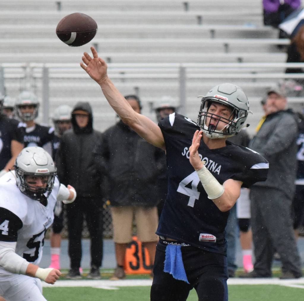 Soldotna quarterback Jersey Truesdell lobs a pass to a receiver Saturday against Eagle River in the Division II state football championship game at Machetanz Field in Palmer. (Photo by Joey Klecka/Peninsula Clarion)