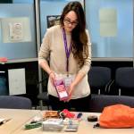 Sherra Pritchard, a public health nurse at the Kenai Public Health Center, puts together an emergency preparedness kit, which will be similar to the ones given out at Saturdays Point of Dispensing exercise, on thursday, Oct. 18, 2018, in Kenai, AK. (Photo by Victoria Petersen/Peninsula Clarion)