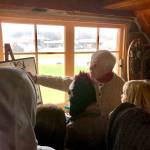 Marge Mullen shows a group of third graders around the Howard Lee Homestead, which was used as the citys first post office when she first homesteaded in Soldotna, on Wednesday, Oct. 17, 2018, in Soldotna, AK. (Photo by Victoria Petersen/Peninsula Clarion)