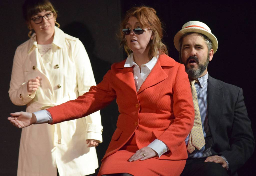 Carla Jenness (in red) and Chris Jenness play out the John McCain and Sarah Palin press conference rag as Hannah Tauriainen observes Monday at Triumvirate North, five miles north of Kenai, at rehearsals for Lame Ducks and Dark Horses. (Photo by Jeff Helminiak/Peninsula Clarion)