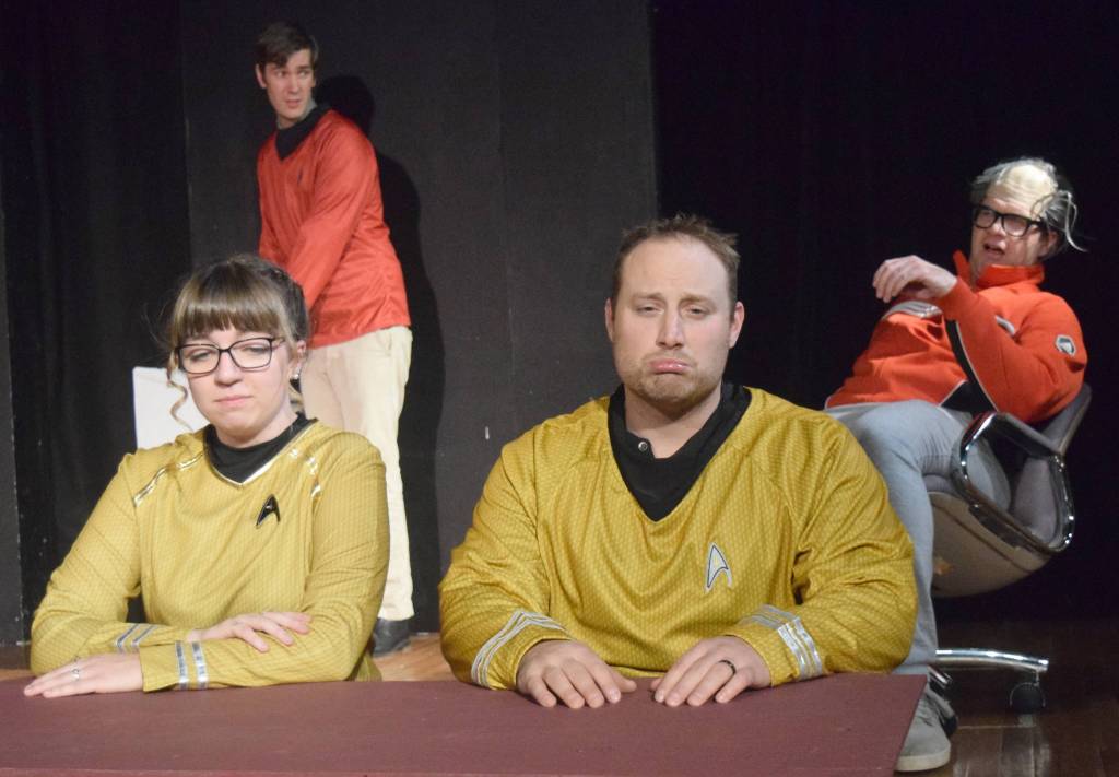 Hannah Tauriainen and Tyler Payment, seated and in yellow, and Brian Lyke and Chris Pepper enact a Star Trek spoof Monday during rehearsals for Lame Ducks and Dark Horses at Triumvirate North, five miles north of Kenai. (Photo by Jeff Helminiak/Peninsula Clarion)