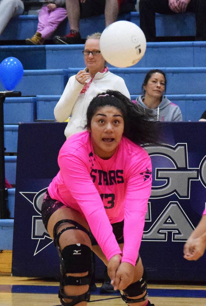 Soldotna junior Ituau Tuisaula works for a dig Thursday night against Kenai Central at Soldotna High School. (Photo by Joey Klecka/Peninsula Clarion)