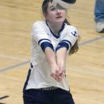 Marina Carroll digs up a ball for Homer against Nikiski on Saturday, Oct. 27, 2018, at Nikiski High School. (Photo by Jeff Helminiak/Peninsula Clarion)