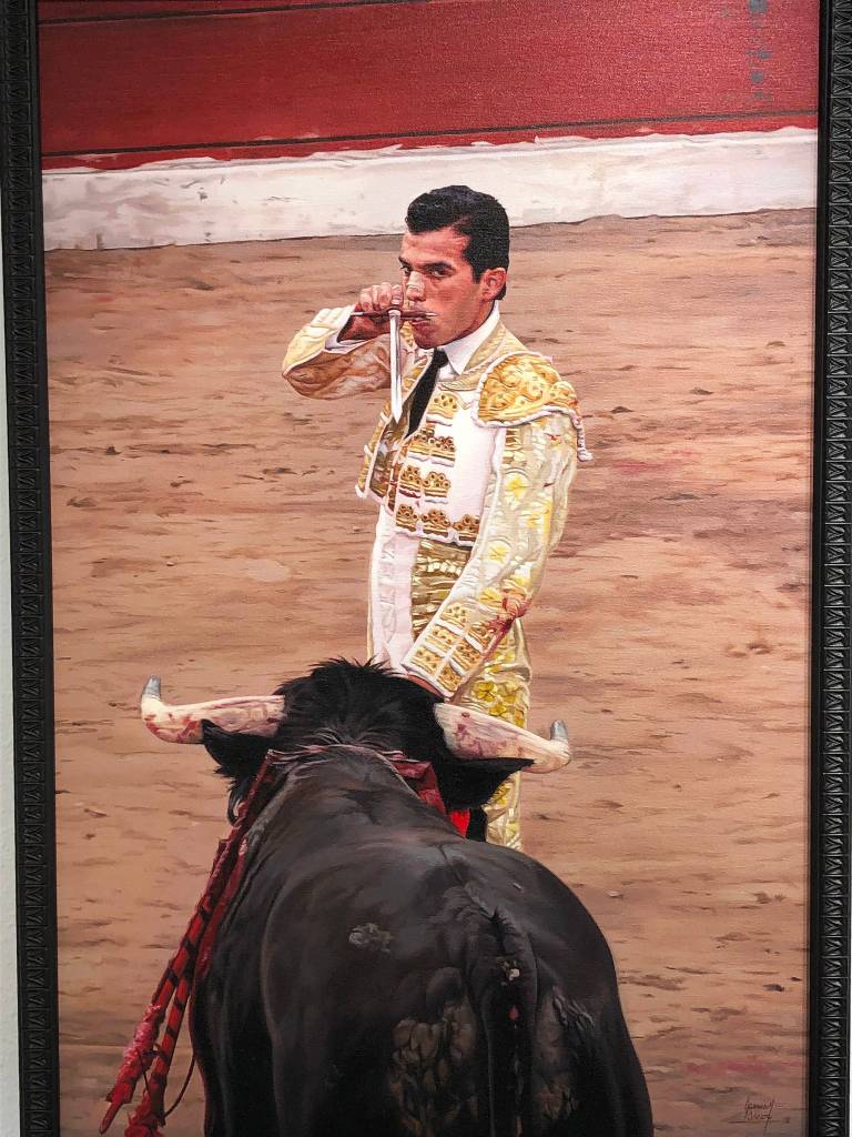 Paintings hang on the walls of the Kenai Fine Arts Center in advance of the Fact and Fiction showing that begins Thursday, Nov. 1, 2018 in Kenai, Alaska. (Photo by Joey Klecka/Peninsula Clarion)