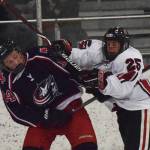 Kenai Central skater Riley Graves (right) and North Poles Caleb Peters get into a shoving match Thursday night at the Peninsula Ice Challenge at the Kenai Multi-purpose Facility. (Photo by Joey Klecka/Peninsula Clarion)