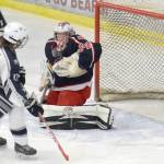 North Pole goalie Nic Clark makes a save in front of Soldotnas Wyatt Medcoff on Friday, Nov. 2, 2018, at the Soldotna Regional Sports Complex. (Photo by Jeff Helminiak/Peninsula Clarion)