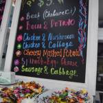 A board depicts the variety of foods available at the Piroshki Coffee and Tea Shoppe, which stands just north of Soldotna on the Kenai Spur Highway. (Photo by Joey Klecka/Peninsula Clarion)