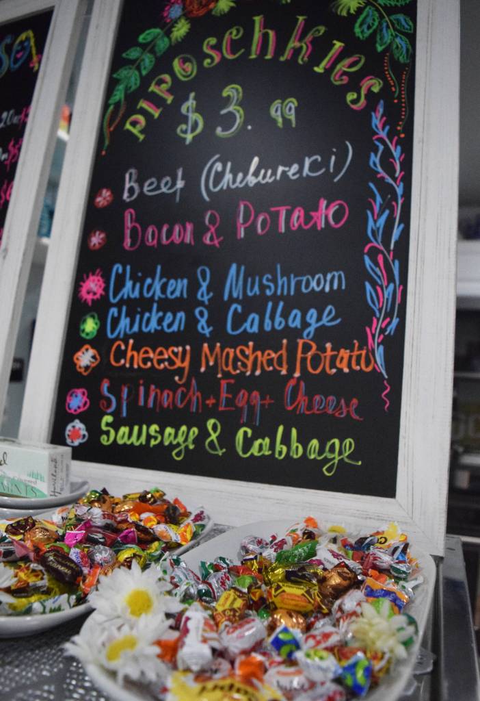 A board depicts the variety of foods available at the Piroshki Coffee and Tea Shoppe, which stands just north of Soldotna on the Kenai Spur Highway. (Photo by Joey Klecka/Peninsula Clarion)