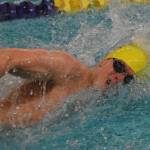 Homers Clayton Arndt races in the boys 100-yard freestyle final Saturday at the 2018 ASAA swimming and diving state championships at Bartlett High School. (Photo by Joey Klecka/Peninsula Clarion)