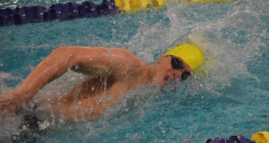 Homers Clayton Arndt races in the boys 100-yard freestyle final Saturday at the 2018 ASAA swimming and diving state championships at Bartlett High School. (Photo by Joey Klecka/Peninsula Clarion)
