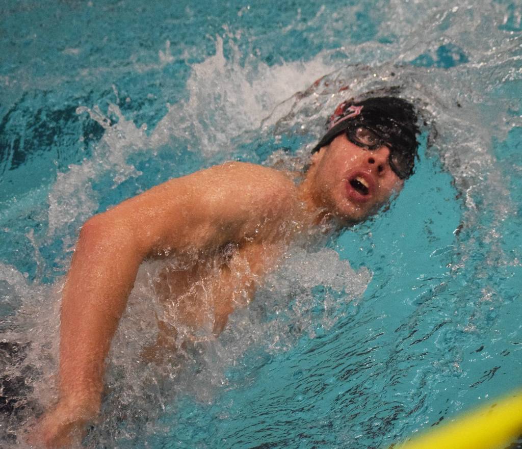 Kenai swimmer Trevor Bagley races in the boys 400-yard freestyle relay Saturday at the 2018 ASAA swimming and diving state championships at Bartlett High School. (Photo by Joey Klecka/Peninsula Clarion)
