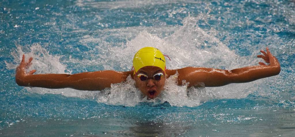 Homers Alia Bales races the butterfly leg in the girls 200-yard medley relay Saturday at the 2018 ASAA swimming and diving state championships at Bartlett High School. (Photo by Joey Klecka/Peninsula Clarion)