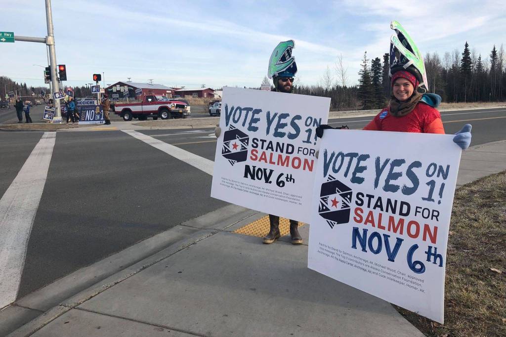 Sarah Youngren and supporters of the Stand for Salmon Ballot Measure 1 hold signs at the intersection of the Sterling and Kenai Spur Highways on Tuesday, Nov. 6, 2018, in Soldotna, Alaska. (Photo by Victoria Petersen/Peninsula Clarion)
