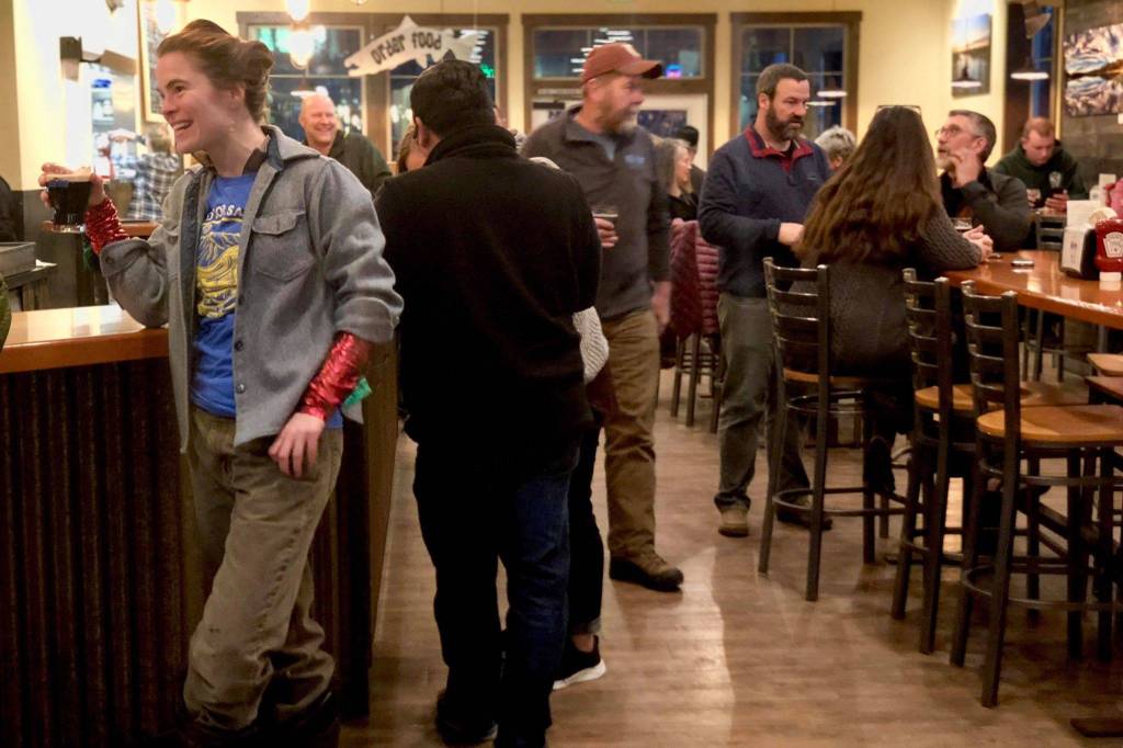Stand for Salmon supporters gather on Election Day to make calls and send texts to friends and family in support of Alaska Ballot Measure 1, on Tuesday, Nov. 6, 2018, in Soldotna, Alaska. (Photo by Victoria Petersen/Peninsula Clarion)